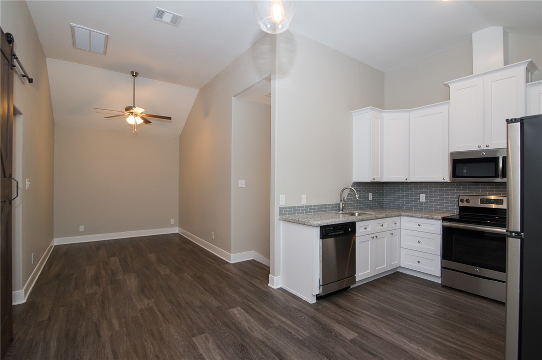 701 Hereford Street, Unit GARAGE APARTMENT College Station, TX 77840 - Photo 6 of 14 a kitchen with a sink and wooden floor