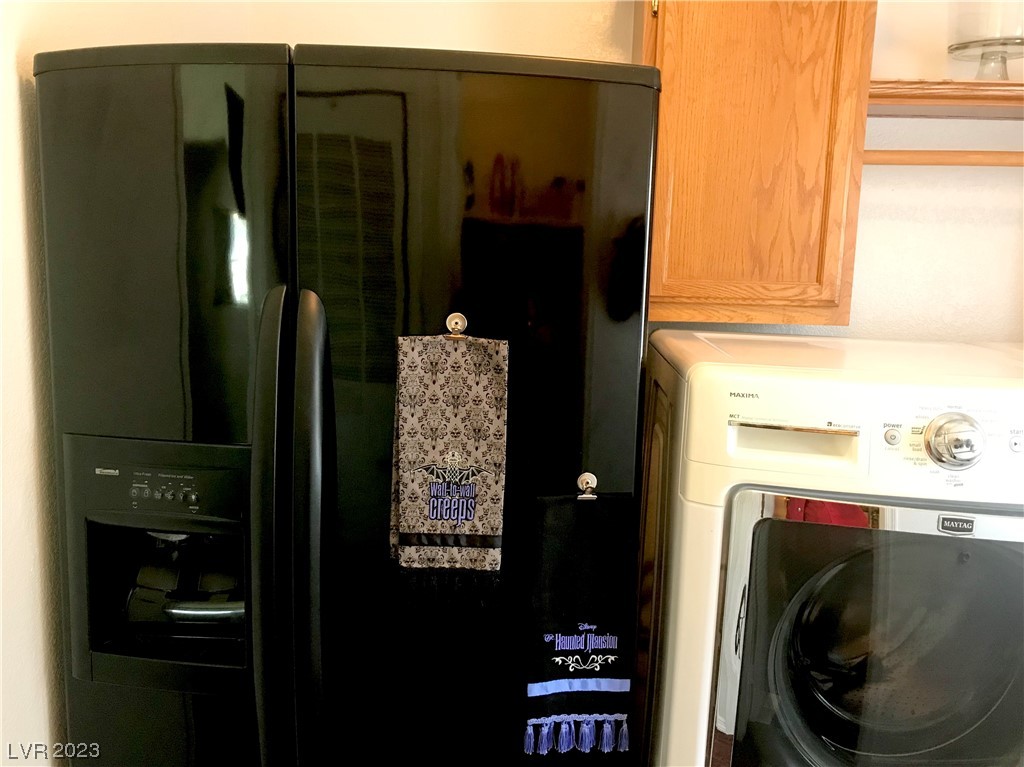 5621 Doubletree Road Pahrump, NV 89061 - Photo 14 of 33 Laundry with extra refrigerator