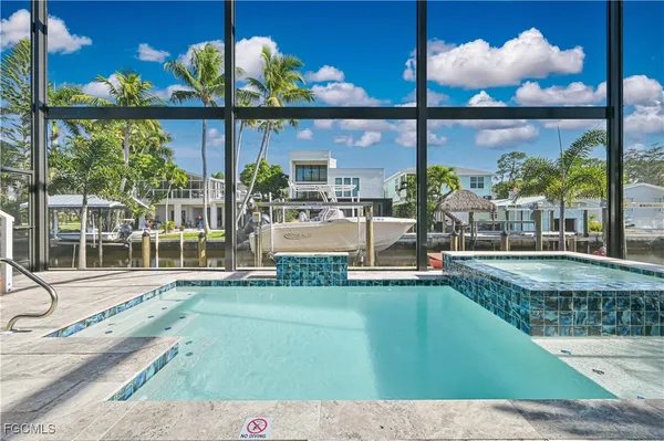 a view of a swimming pool with a patio