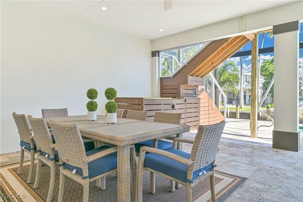 a view of a dining room with furniture and a window