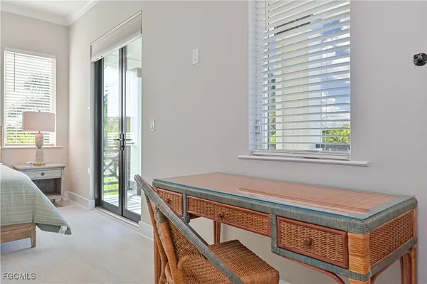 a living room with a bed furniture and a window