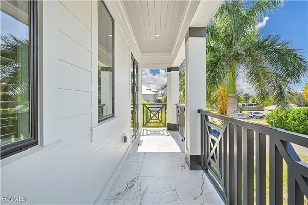 a spacious bathroom with a bathtub a double vanity sink a mirror and shower
