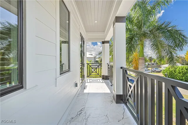 a spacious bathroom with a bathtub a double vanity sink a mirror and shower
