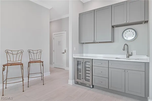 a living room with furniture a large window and a table