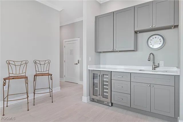 a living room with furniture a large window and a table