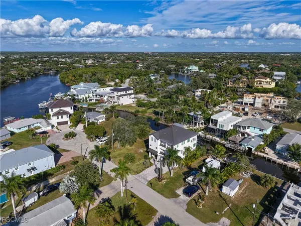 an aerial view of a house with a ocean view