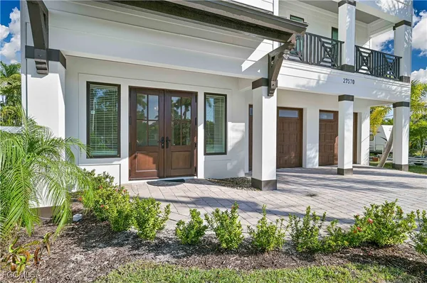 a view of a building with potted plants and windows