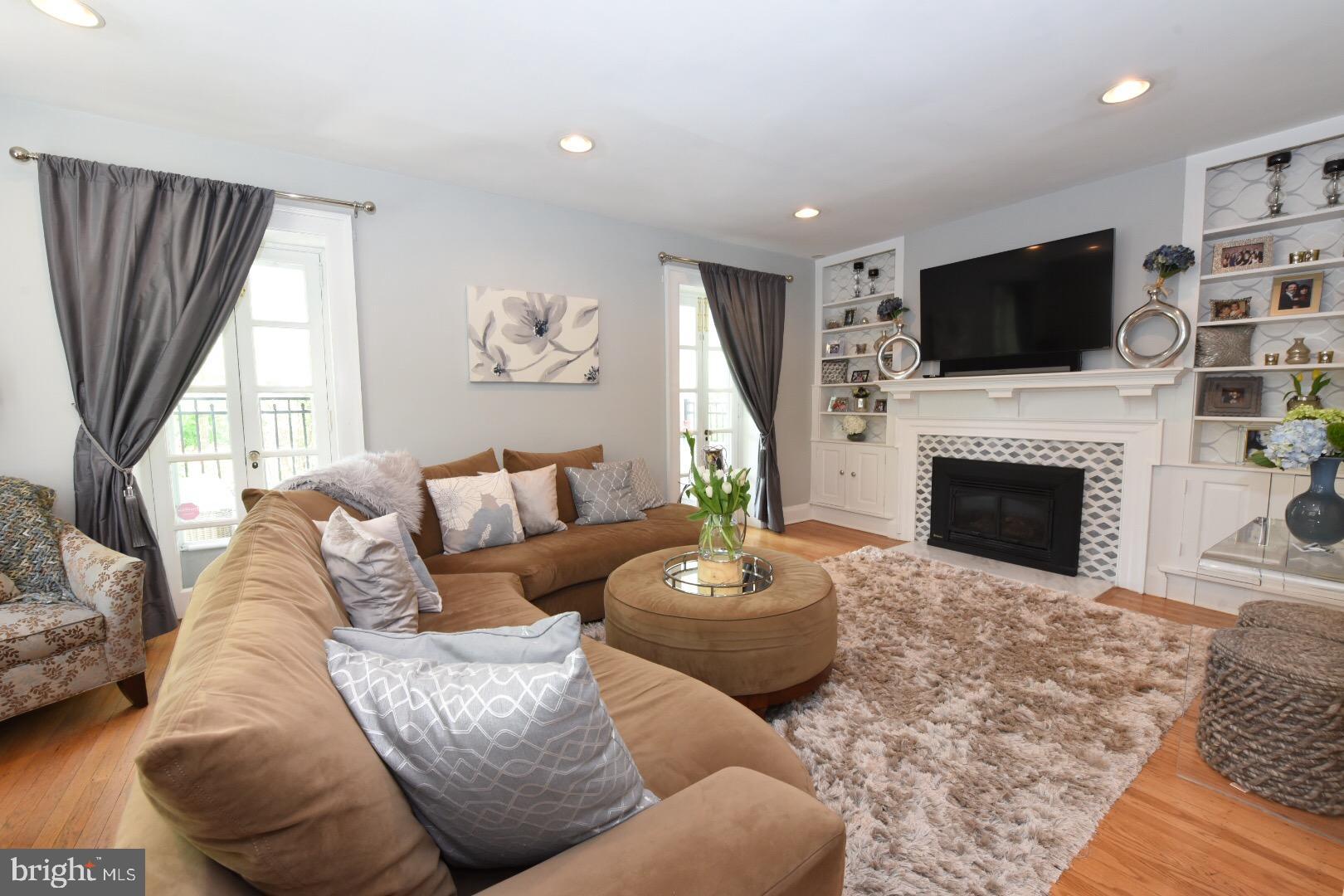 LR with gas fire place & custom built in cabinet
