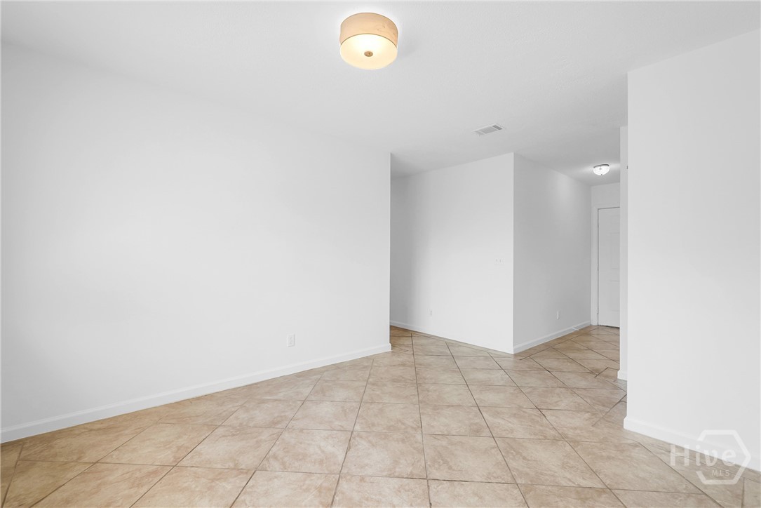 103 Hillgate Road Savannah, GA 31404 - Photo 21 of 47 Dining Room with view to foyer and hallway