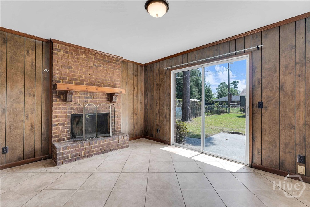 103 Hillgate Road Savannah, GA 31404 - Photo 36 of 47 Den with fireplace and glass slider to xlg patio