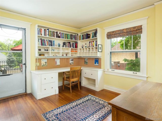 a room with furniture cabinets and window