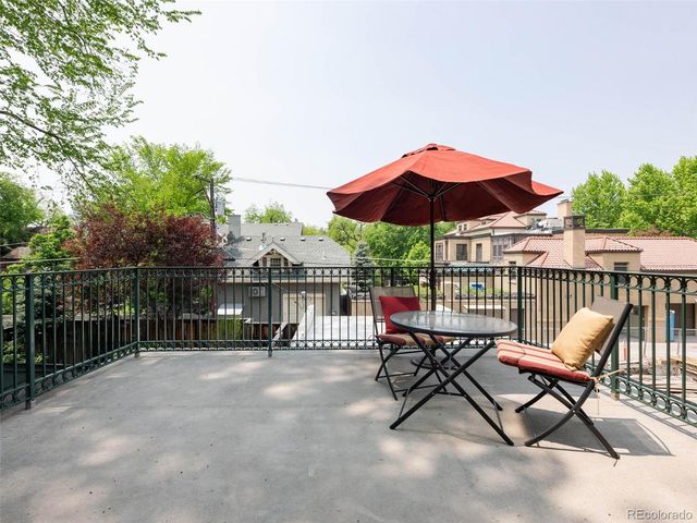 a view of a bench in wooden floor