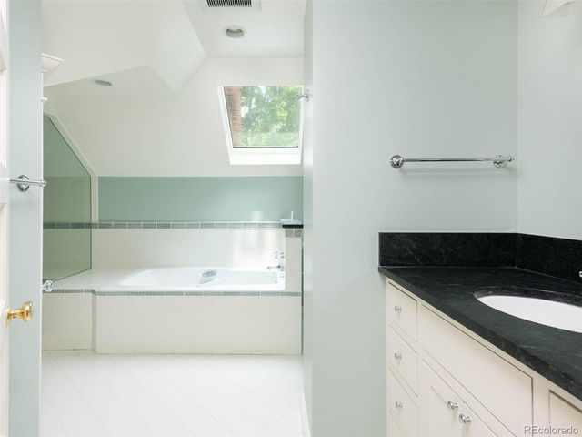 a view of a bathtub in a bathroom