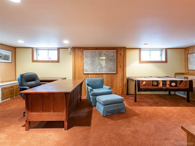 a living room with furniture and a pool