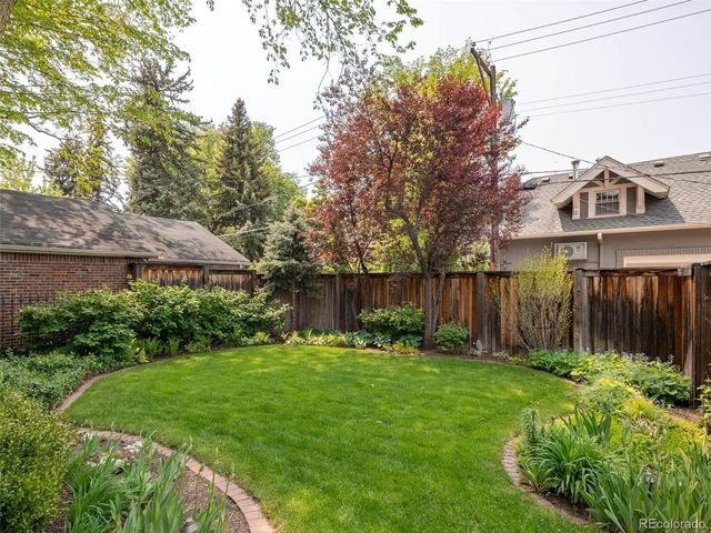 a view of a house with a yard and plants