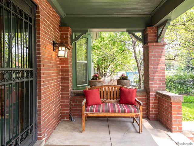 a outdoor space with patio the couches and a dining table with garden view