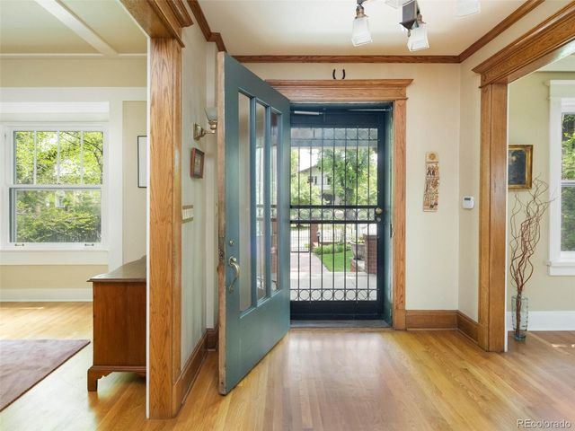 a view of entryway with wooden floor