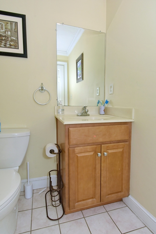966 Washington Street, Unit 2 Weymouth, MA 02189 - Photo 18 of 25 a bathroom with a sink toilet and mirror