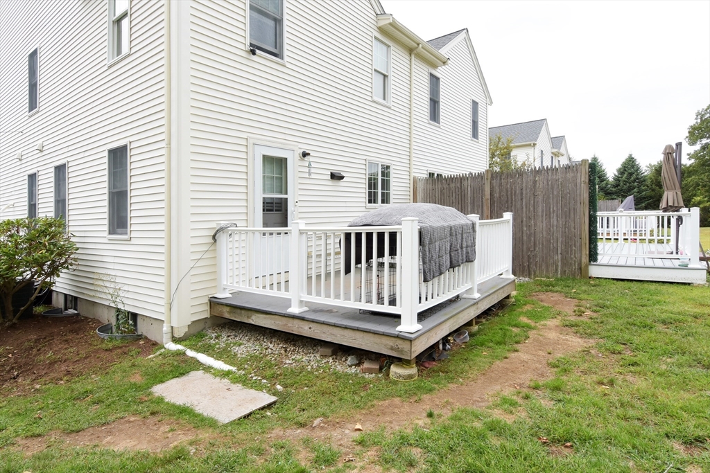 966 Washington Street, Unit 2 Weymouth, MA 02189 - Photo 23 of 25 a view of a house with a yard