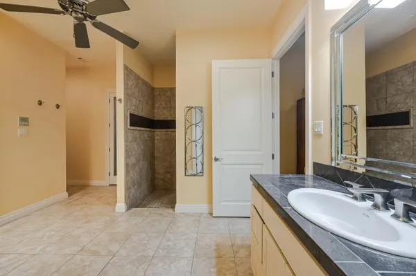 a view of a dining room with furniture and potted plant