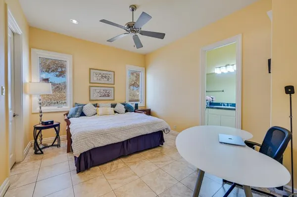 a view of a yard with wooden fence