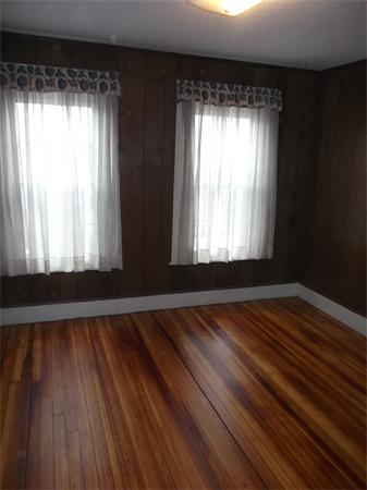 28 Itendale Street Springfield, MA 01108 - Photo 6 of 17 a view of empty room with wooden floor and fan