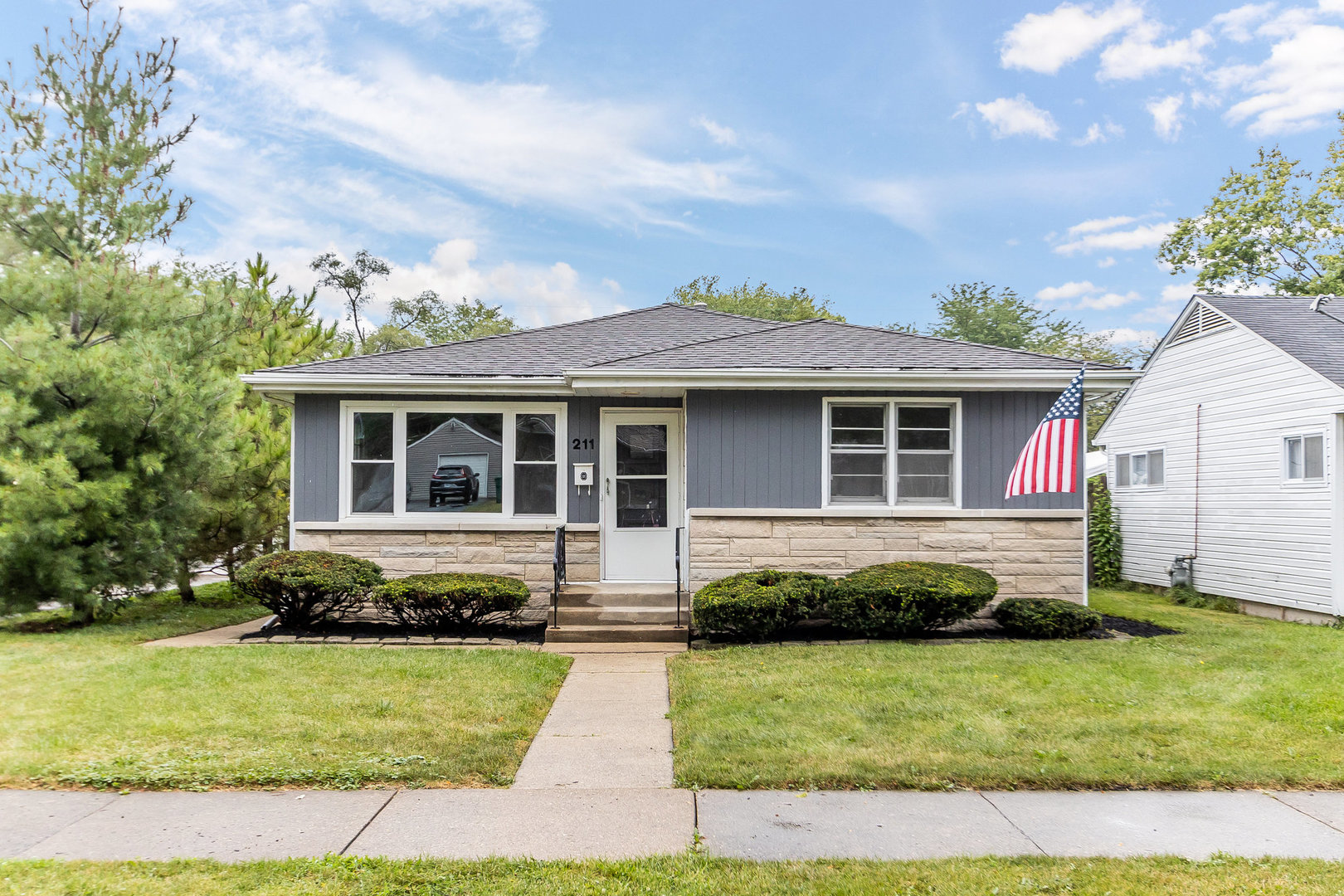 211 South Reed Street Joliet, IL 60436 - Photo 1 of 15 a front view of a house with a yard