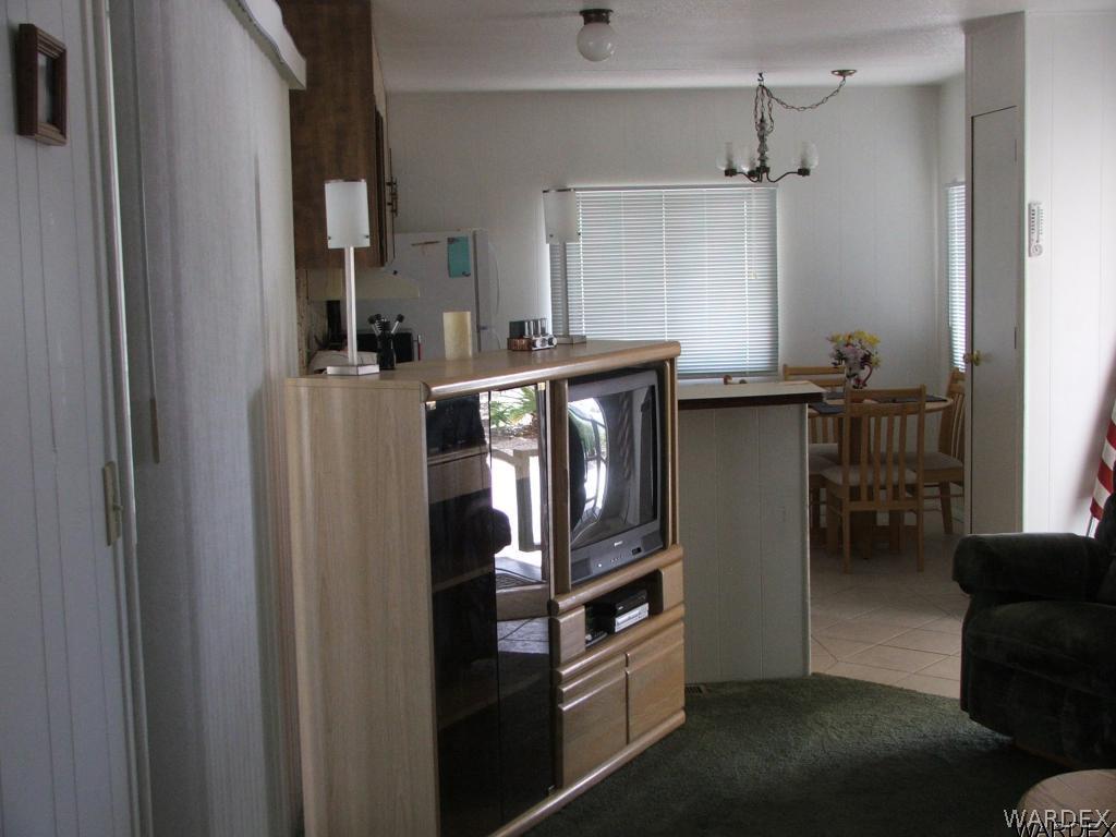 1663 East Gran Fort Mohave, AZ 86426 - Photo 14 of 34 a kitchen with stainless steel appliances granite countertop a refrigerator and a stove