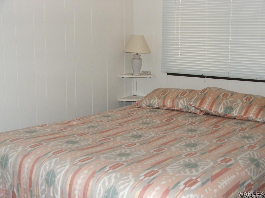 1663 East Gran Fort Mohave, AZ 86426 - Photo 16 of 34 a bedroom with a bed and a window