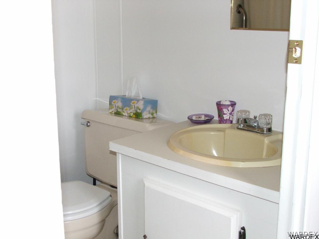 1663 East Gran Fort Mohave, AZ 86426 - Photo 17 of 34 a bathroom with a sink toilet and a mirror