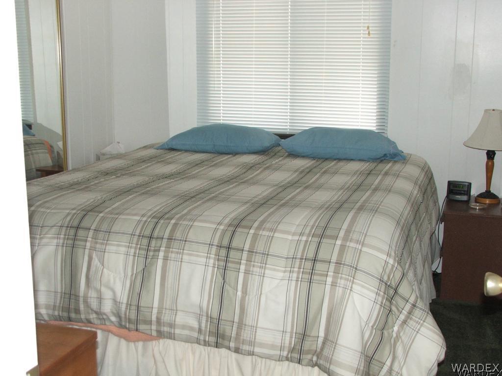 1663 East Gran Fort Mohave, AZ 86426 - Photo 20 of 34 a bedroom with a bed and a window