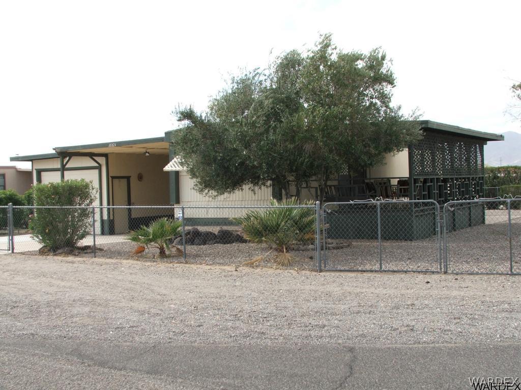 1663 East Gran Fort Mohave, AZ 86426 - Photo 2 of 34 a backyard of a house with table and chairs