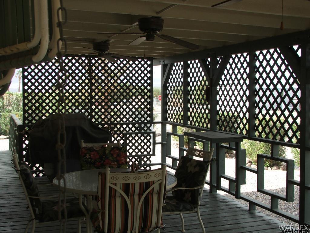 1663 East Gran Fort Mohave, AZ 86426 - Photo 25 of 34 a view of a chairs and table in the wooden balcony