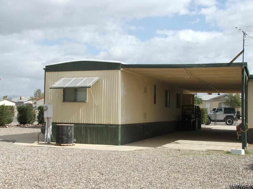 1663 East Gran Fort Mohave, AZ 86426 - Photo 28 of 34 a front view of a house with a garage