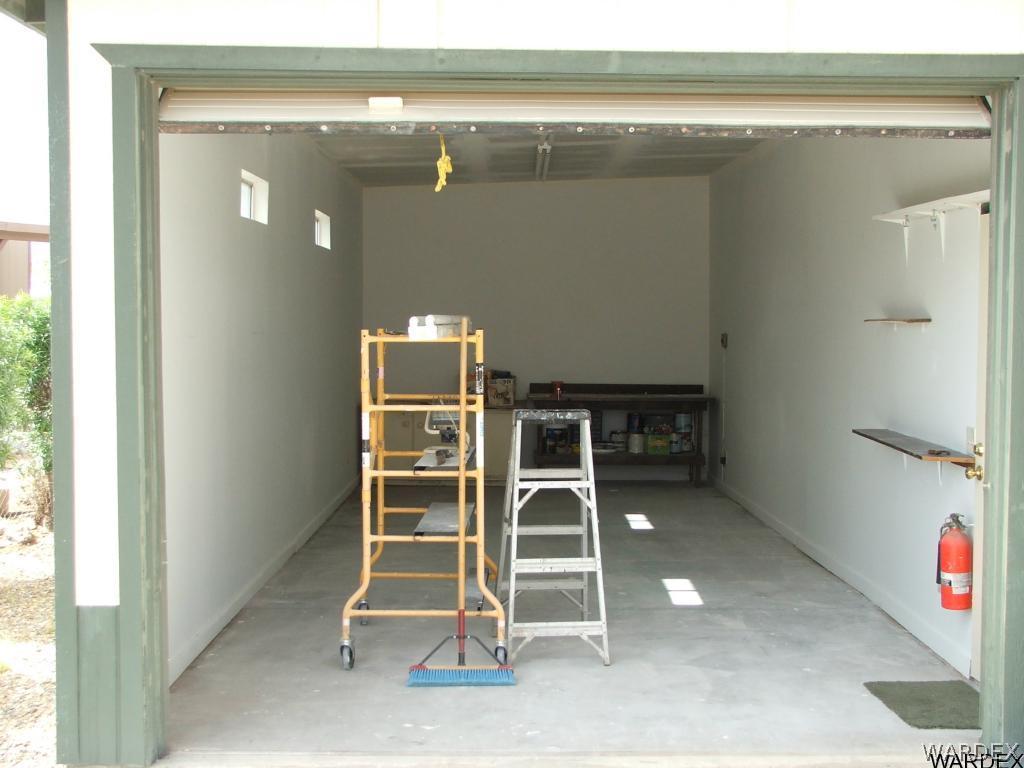 1663 East Gran Fort Mohave, AZ 86426 - Photo 7 of 34 a view of an empty room with wooden floor and windows