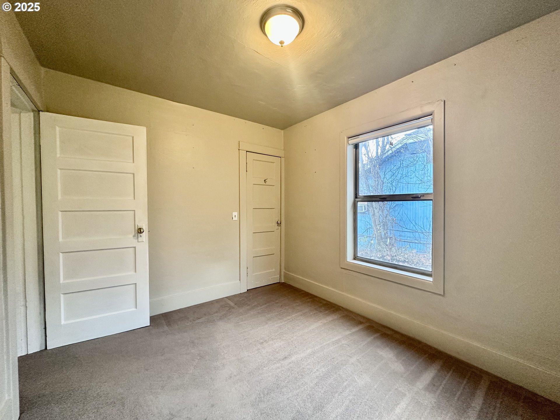 517 Main Street Klickitat, WA 98628 - Photo 24 of 41 an empty room with windows and closet