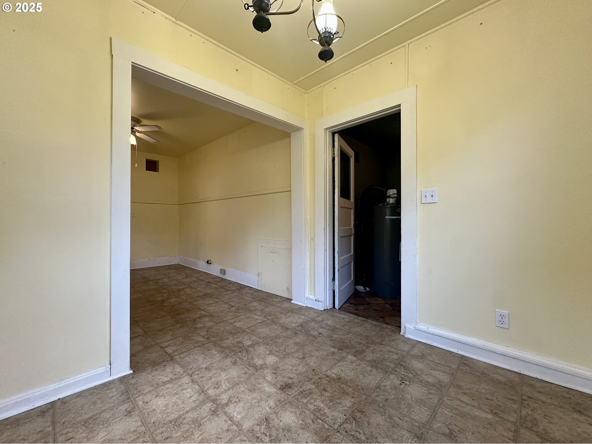 517 Main Street Klickitat, WA 98628 - Photo 35 of 41 an empty room with a ceiling fan and entryway
