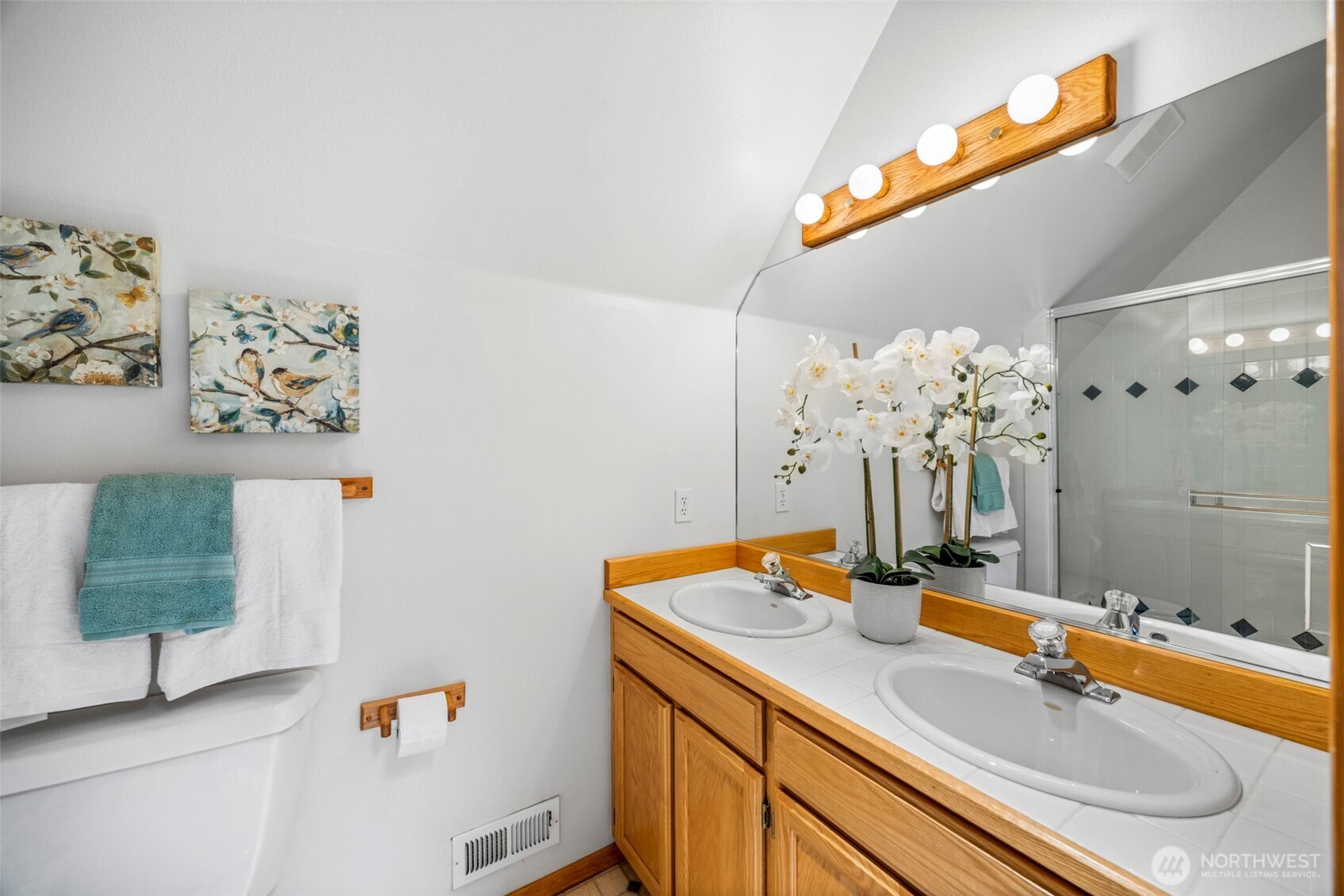 19736 Northwest Stavis Bay Road Seabeck, WA 98380 - Photo 23 of 39 a bathroom with a granite countertop sink and a mirror