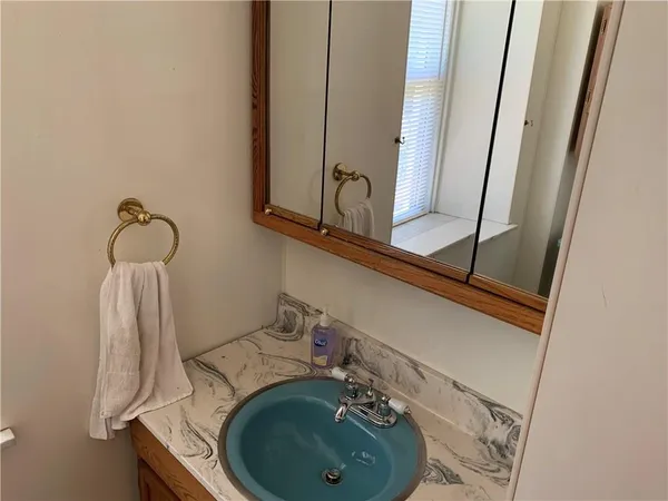 a bathroom with a sink and a mirror