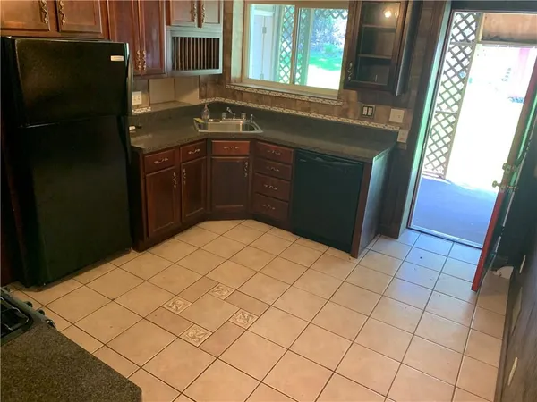 a kitchen with a sink and cabinets