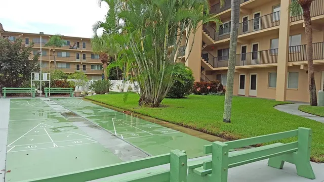 a view of a building with a yard