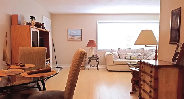 a living room with furniture and a chair