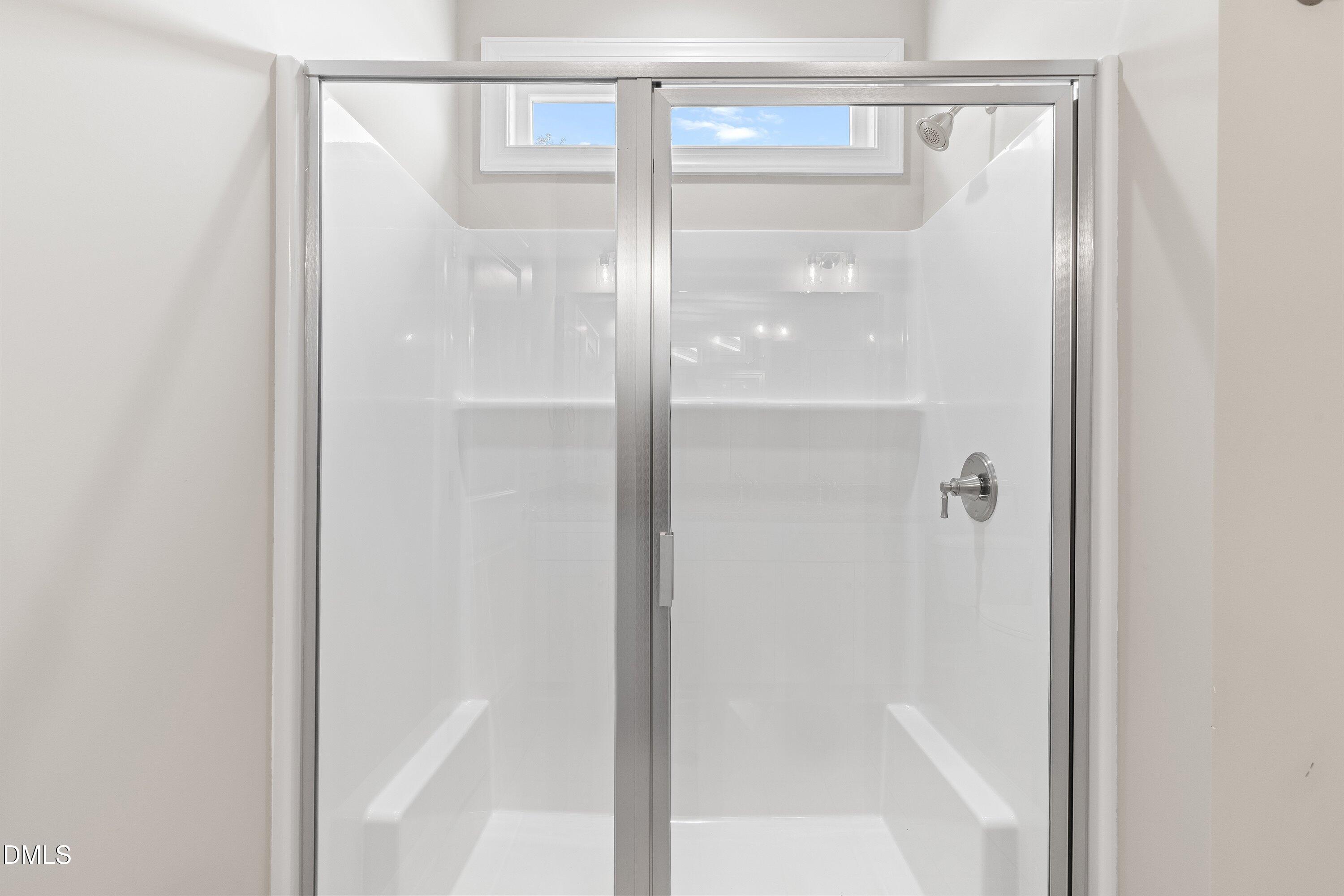1115 Nor-Am Road Pikeville, NC 27863 - Photo 32 of 40 a bathroom with a glass shower door