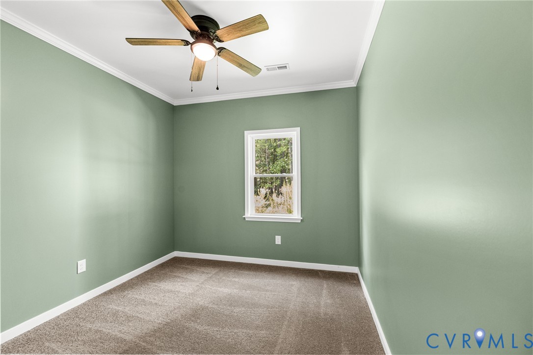 2211 Osborne Road Chester, VA 23831 - Photo 9 of 42 Neutral-toned carpeting, light , white crown moldi