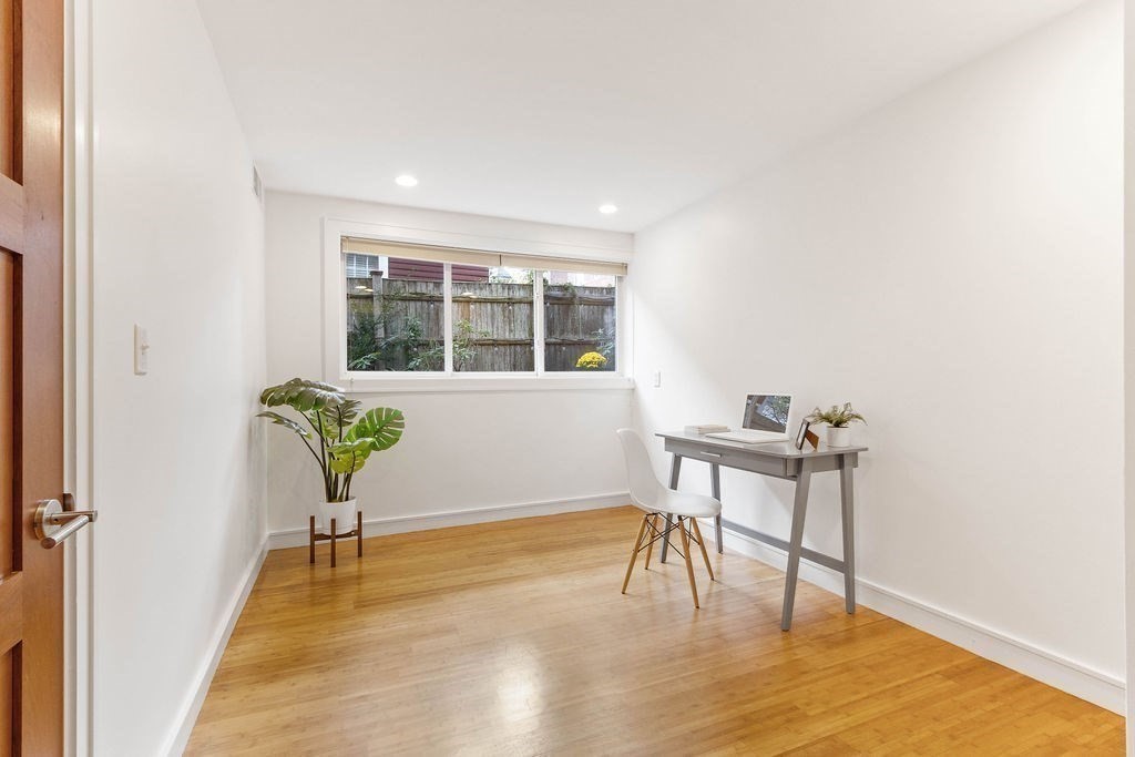 27 West Street, Unit 1 Cambridge, MA 02139 - Photo 13 of 26 a view of a livingroom with furniture window and wooden floor
