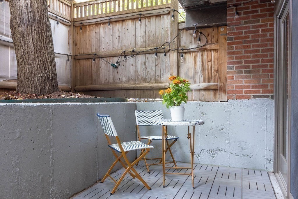 27 West Street, Unit 1 Cambridge, MA 02139 - Photo 20 of 26 a view of balcony with wooden floor and seating space