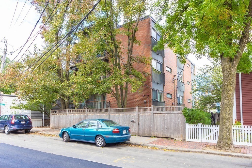 27 West Street, Unit 1 Cambridge, MA 02139 - Photo 24 of 26 a car parked in front of a house