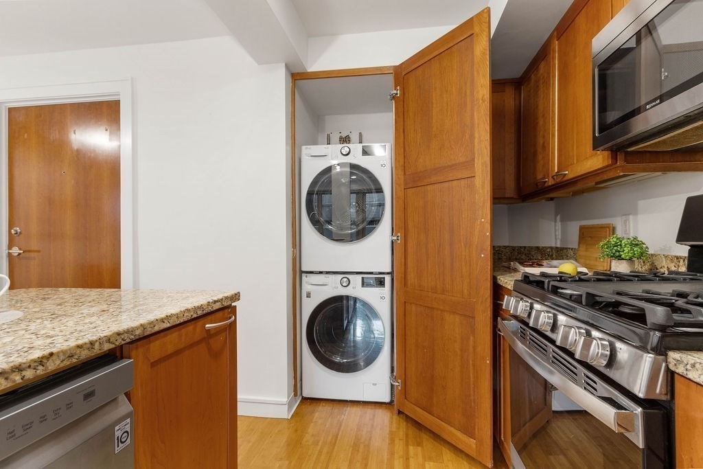27 West Street, Unit 1 Cambridge, MA 02139 - Photo 8 of 26 a utility room with sink dryer and washer