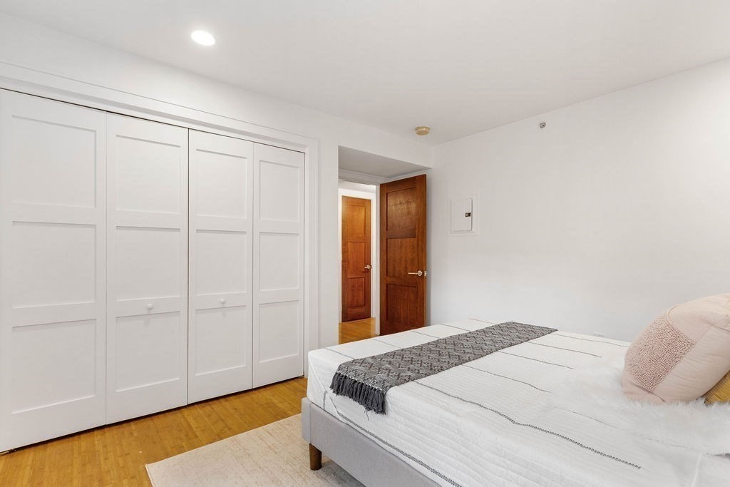 27 West Street, Unit 1 Cambridge, MA 02139 - Photo 10 of 26 a bedroom with a bed and a window