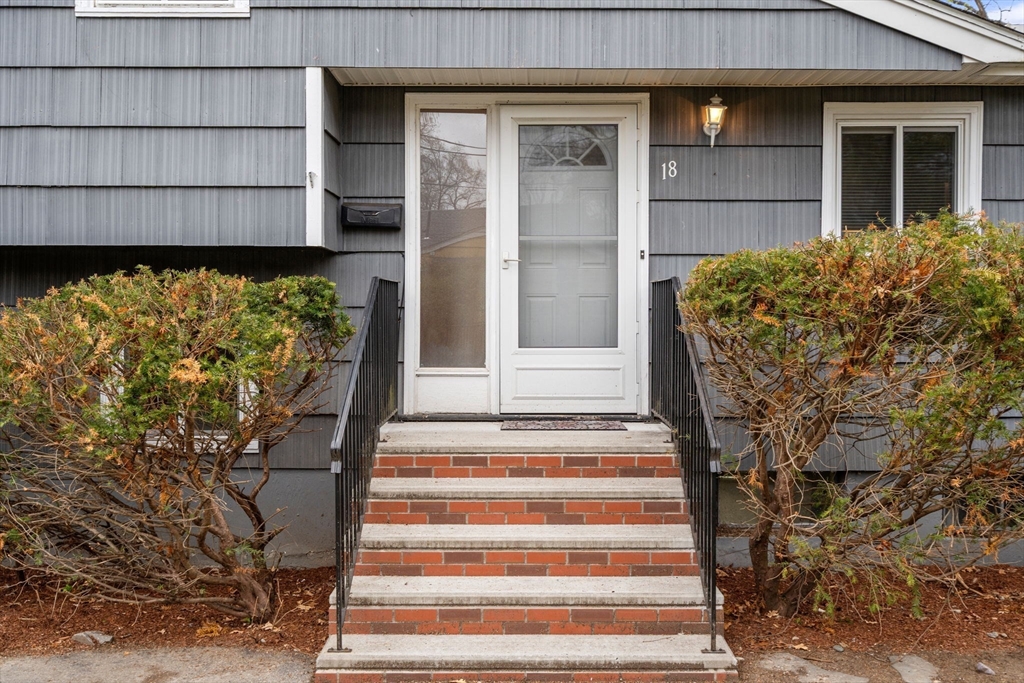 18 Royce Road Framingham, MA 01701 - Photo 22 of 30 a front view of a house with a garden